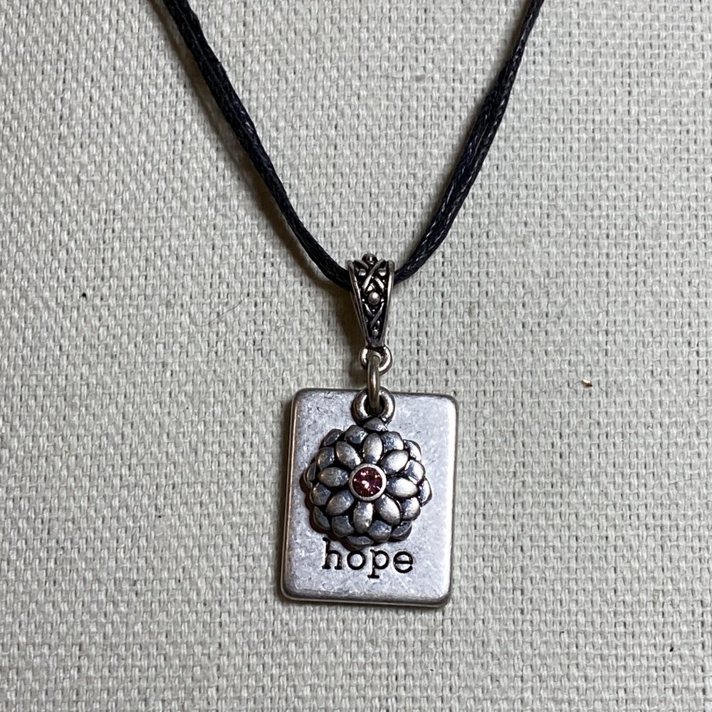 Charm style necklace on dainty leather cord